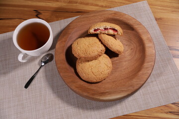 berry tea and a decorative wooden plate is very beautiful for vegetables and cookies, sweets and desserts as an element of decor for interior design