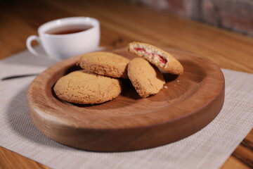berry tea and a decorative wooden plate is very beautiful for vegetables and cookies, sweets and desserts as an element of decor for interior design