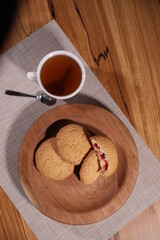 berry tea and a decorative wooden plate is very beautiful for vegetables and cookies, sweets and desserts as an element of decor for interior design