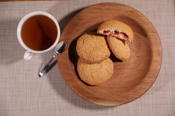 berry tea and a decorative wooden plate is very beautiful for vegetables and cookies, sweets and desserts as an element of decor for interior design
