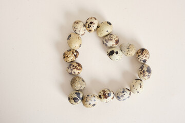 quail eggs on light texture background copy space