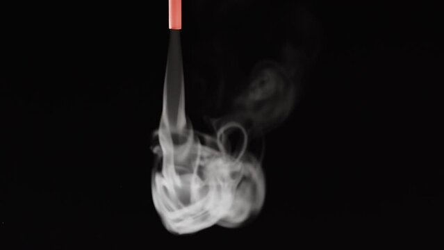 White smoke on black background in slow motion