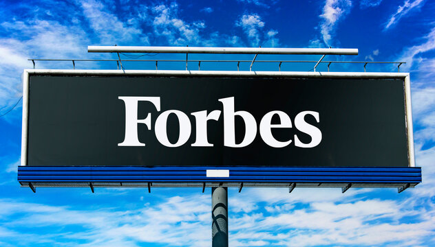 Advertisement billboard displaying logo of Forbes