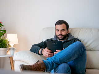 Fototapeta premium student working and relaxing in home with tablet