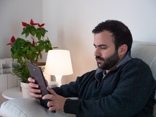 businessman working with tablet in home