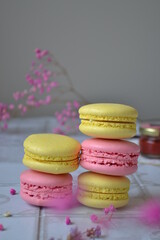 yellow and pink macaroons on a table