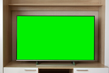 A snapshot of a TV with a horizontal green screen layout