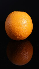 fresh fruit orange on black background