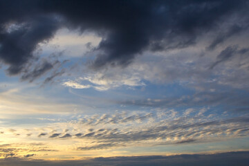 Clouds in the sky come in a variety of colors after heavy rain after the storm enters the end of...