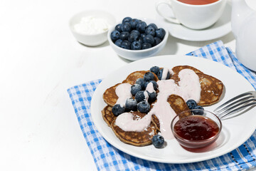 homemade pancakes with blueberries and jam