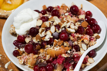 sweet crumble with fresh berries for breakfast, closeup