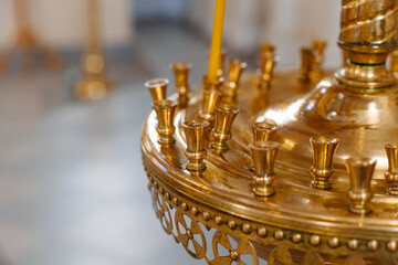Close-up of a place for golden altar candles in a Christian church. Italy, Europe
