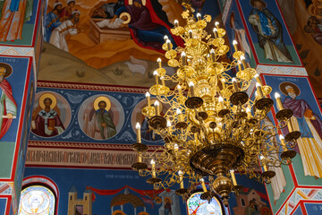 Orthodox Church Europe. Bright blue vintage interior of an ancient historic Greek church.