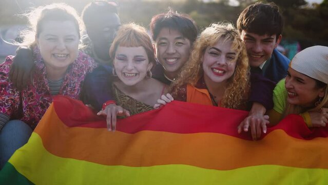 Diverse young friends celebrating gay pride festival - LGBTQ community concept 