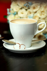 Wedding rings and coffee