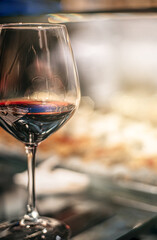 close-up of a glass of red wine on a blurred background. concept gastronomy and wine tasting in spain. selective blur and natural light.