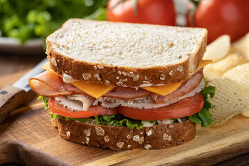 Turkey and ham sandwich on whole grain bread