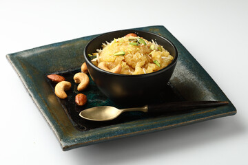 Moong dal halwa is a classic Indian sweet dish made with moong lentils, sugar, ghee and cardamom powder