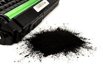 Black toner for a laser printer on a white background. Toner powder isolate. Cartridge