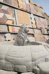 concrete figure of a lion.Stone statue of a lion