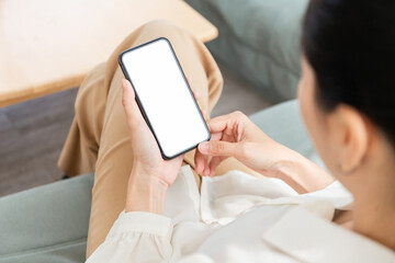 cell phone blank white screen mockup.hand holding texting using mobile on desk at office.background empty space for advertise.work people contact marketing business,technology