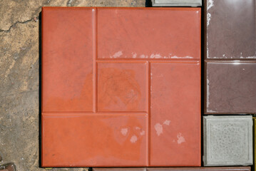 Texture of different colored patterned paving slabs . Modern road surface.