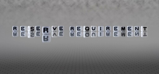 reserve requirement word or concept represented by black and white letter cubes on a grey horizon...