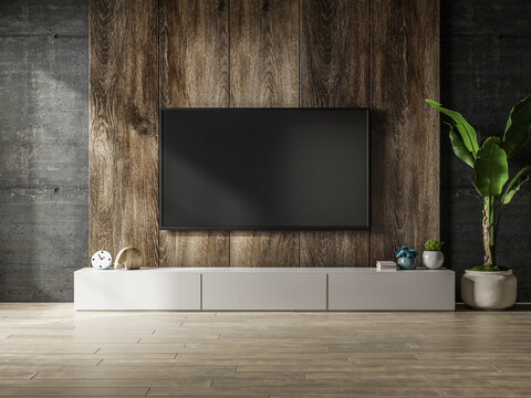Cabinet with wooden wall mounted tv in interior concrete room.