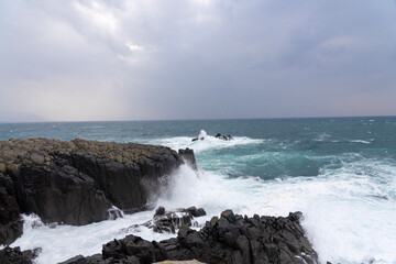 waves crashing on rocks