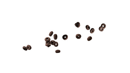 Chocolate rings cereal spill out into a bowl. Breakfast.