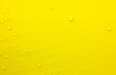 Water drops on a yellow background.