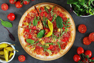 Pizza diavolo flat lay with pepper