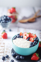Milk rice with berries ready for breakfast