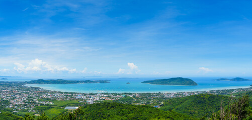 Fototapeta premium High angle view, Chalong Bay, Phuket, Thailand. Viewpoint on the mountain overlooking the tourist city, the marina, the scenery, the sea view in the panoramic view.