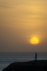 Man at sunset in the coast of Dakar. Senegal.