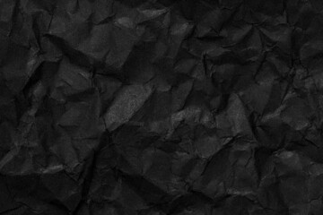 Black crumpled paper texture background