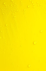 Water drops on a yellow background.