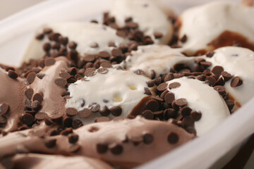 close up of chocolate flavor ice cream in a container 