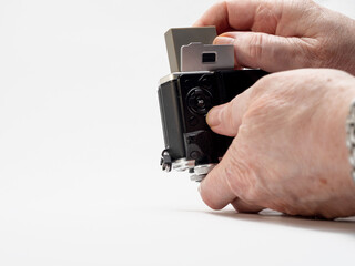Photographer changing battery in his mirrorless camera  Selected Focus