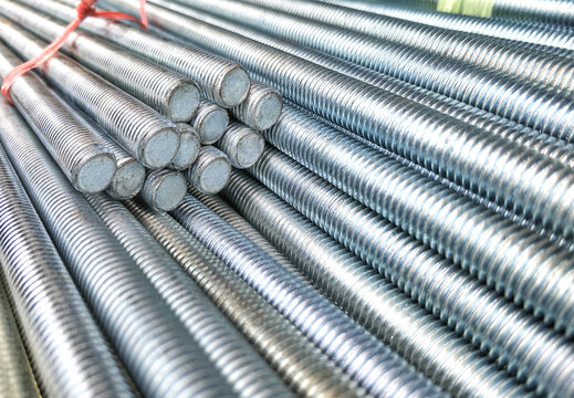 Selective focus of many long screw threaded rods in construction and industrial concept