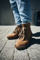 Young woman in stylish fashionable leather lace-up shoes. Fashionable collection of women's autumn shoes.