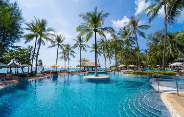 Amazing tropical paradise beach with swimming pools and coconut palms - obrazy, fototapety, plakaty