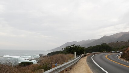 Pacific coast highway 1, Cabrillo road along ocean, foggy California, Big Sur, USA. Coastal road...