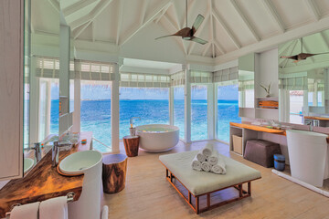 Luxury bathroom interior design in summer resort vacation, blue sea sky view. Idyllic couple travel...