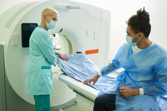 Man visiting modern hospital for tomography examination
