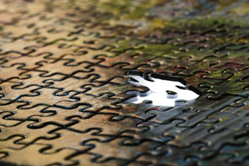 close-up of the parts of the puzzle game, the last element, the finale of a large project