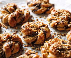 Close up view  to sweet rolls with the addition of chocolate and almonds, focus on the bun inside. Delicious homemade pastries