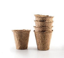 Fototapeta na wymiar empty peat cups on a white background