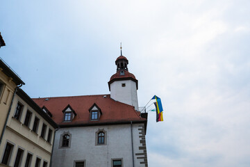 Fototapeta na wymiar Town hall of Schmöllin in Thuringia, with flag of Ukraine
