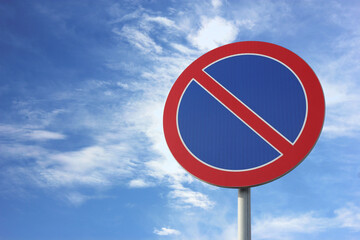 Traffic sign No Parking against blue sky, space for text